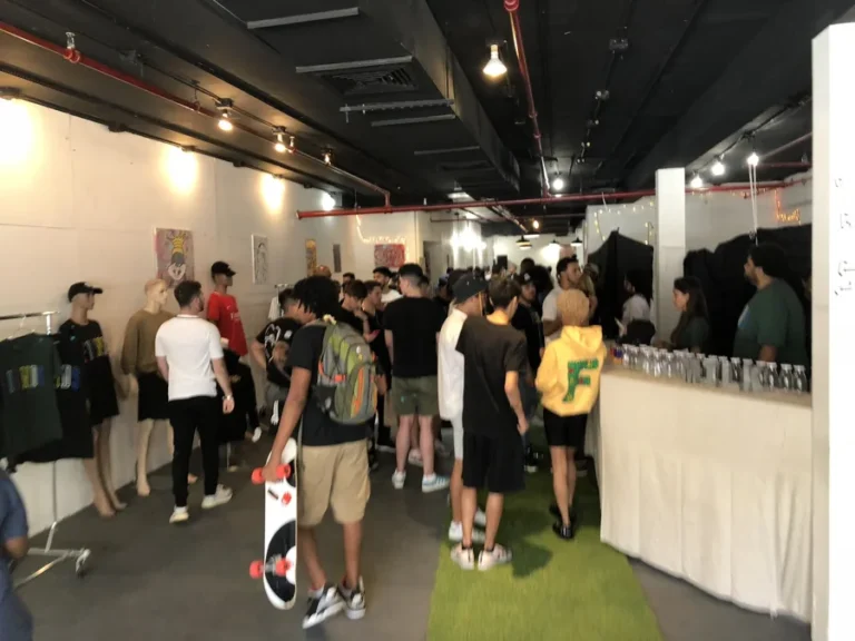 Fans exploring the FIENDSHOP retail environment.