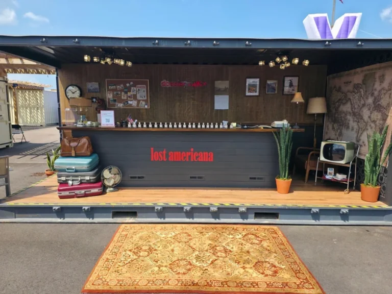 The built Lost Americana Motel sampling environment at MGK Day 2026 in Cleveland.