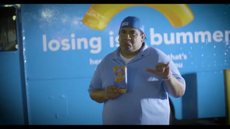 A fan with the Basketbawl edition in front of the Kraft truck, New Orleans · original agency film.