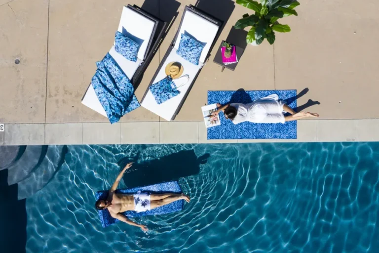Backyard Accents towels, cushions and pool-float covers in the original campaign photography.