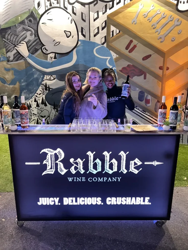Rabble’s branded bar within the mural-filled setting.