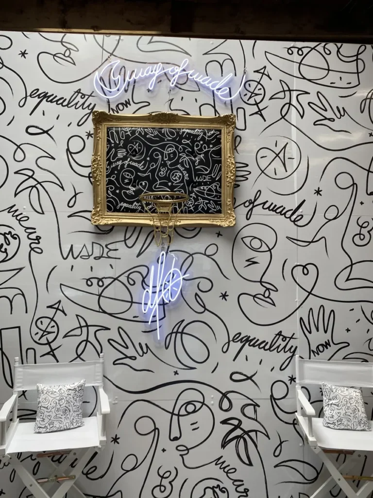 DFT’s linework surrounds a gold basketball hoop and illuminated signature.