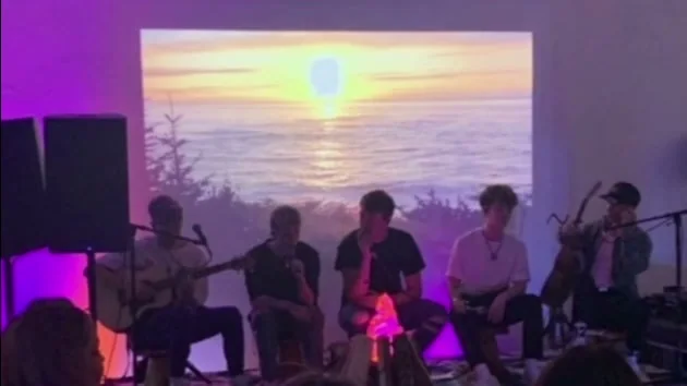 Why Don’t We performing inside the tour pop-up · Film still.