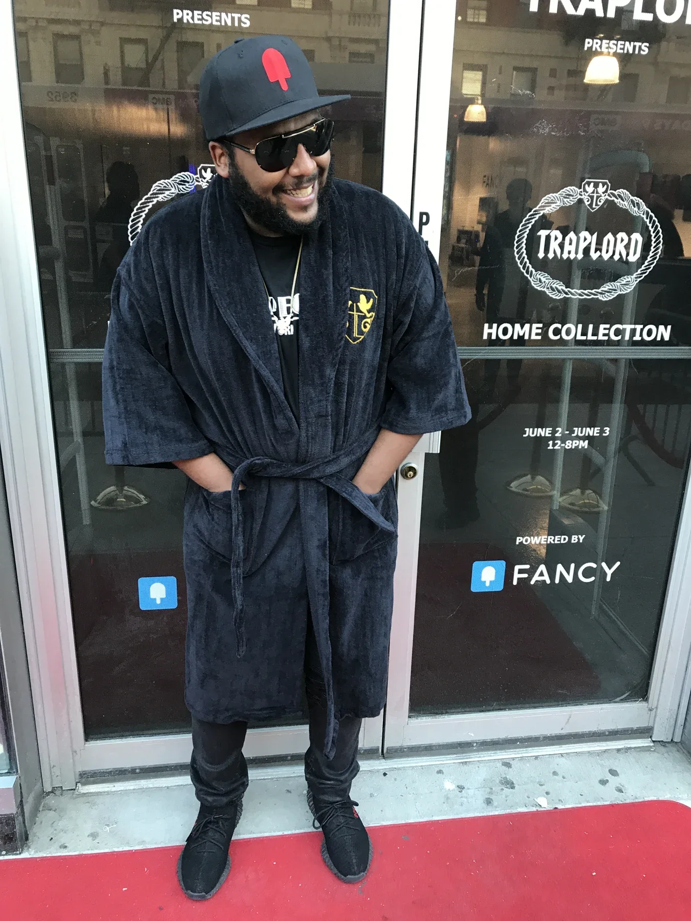 Ferg outside the Harlem storefront in a collection robe · June 3, 2017.