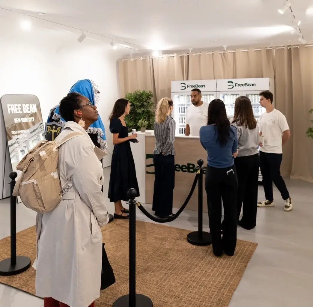 Guests inside the FreeBean pop-up on opening day · built space, September 2026.