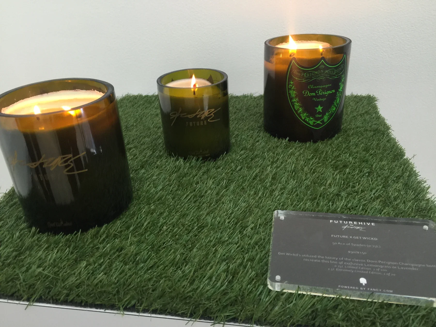 Candles presented on a textured product display · FutureHive Fairfax.